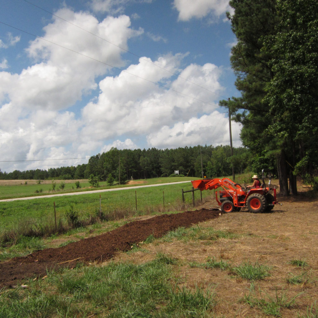 Mulching with a tractor, 2011.