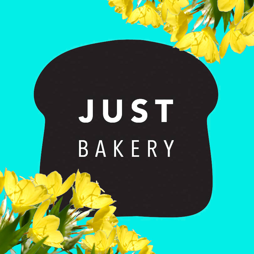 Just Bakery sign with evening primrose flowers