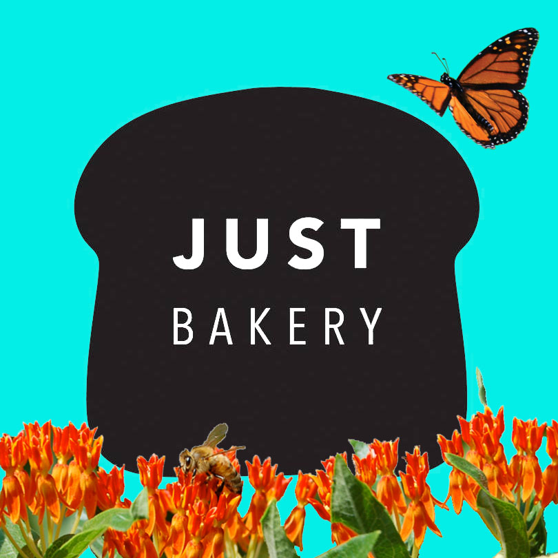 Just Bakery sign with a monarch butterfly, honeybee, and butterfly weed